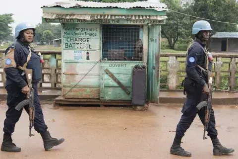 Armed UN Peacekeepers (one woman and one man) patrol the PK5 district in Bangui, Central African Republic