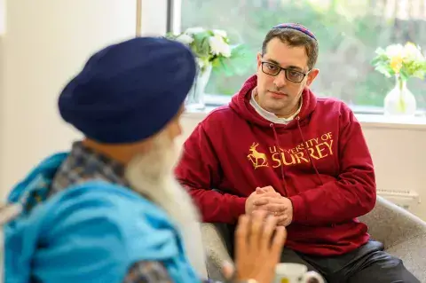 Photo by Khalid Bari KAICIID Fellow Rabbi Alex Goldberg from the University of Surrey in the UK talks with a member of the Sikh community