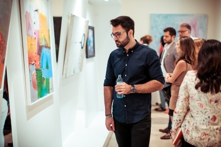 Spectators at the Bridges Exhibition at the KAICIID Dialogue Centre. Photo: David Pan. 